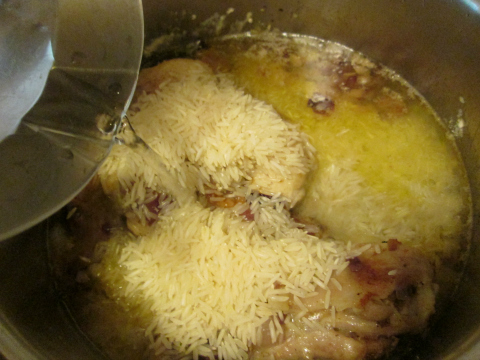 Adding Water to Rice and Chicken
