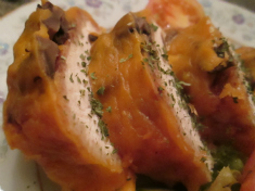 sliced chicken and cheese with mushrooms