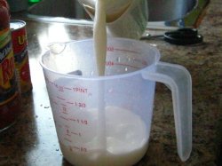 Milk into Measuring Cup
