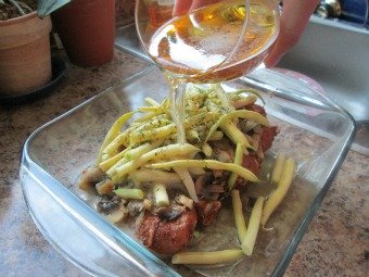 Pouring Beer Over Chicken for Beer Recipe